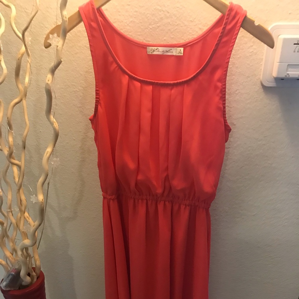 Salmon pink high and low dress.